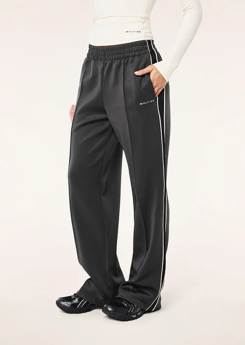 Black track pants with white stripes on a white background