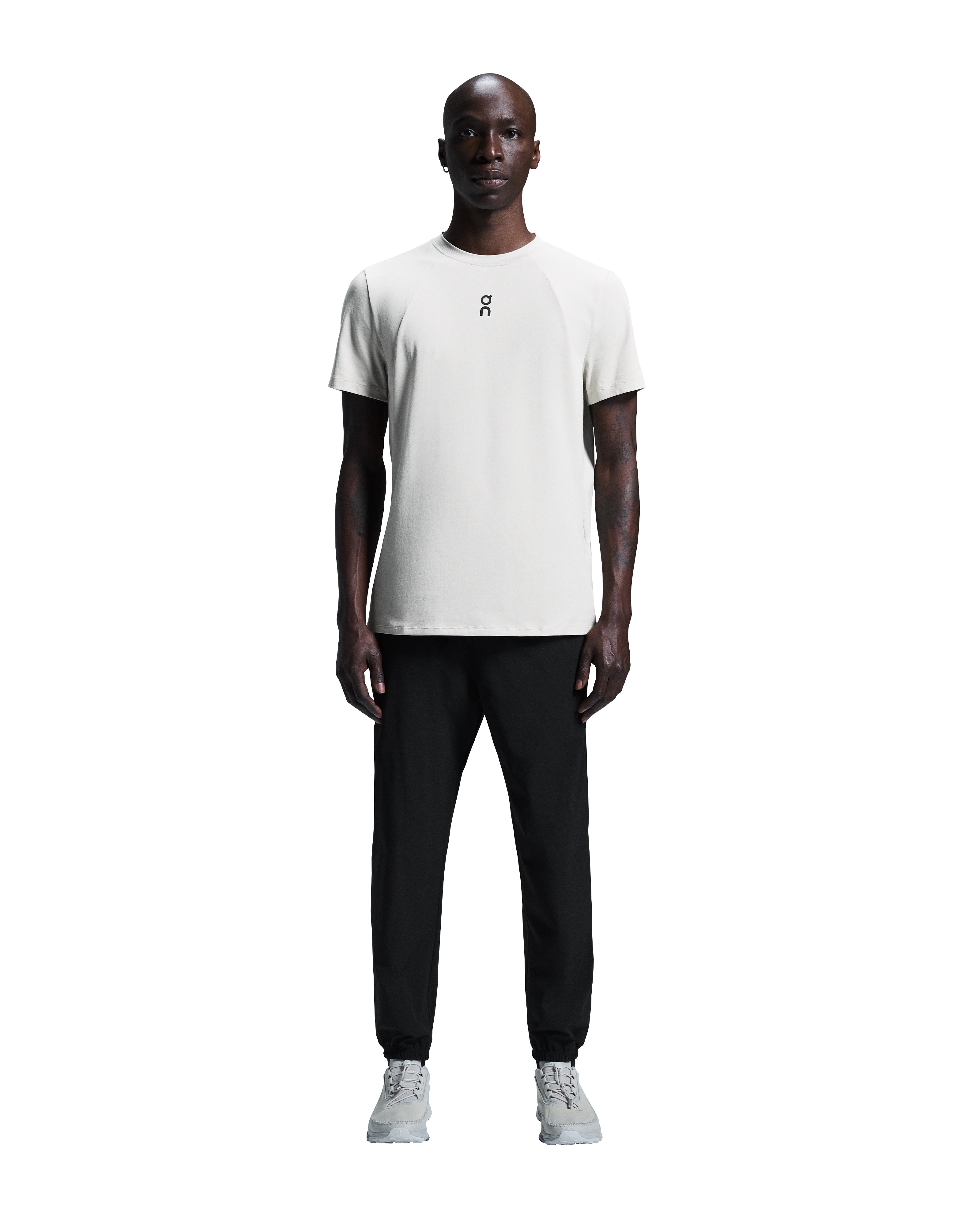Men's On Running Black Focus Pants with on logo, styled with a matching on running t shirt and white on running trainers
