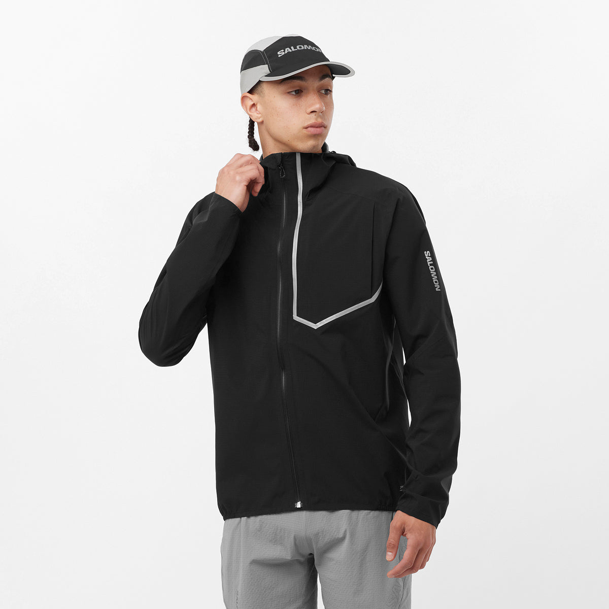 Men's Salomon Black Bonatti Trail Jacket with reflective logo and model wearing medium jacket