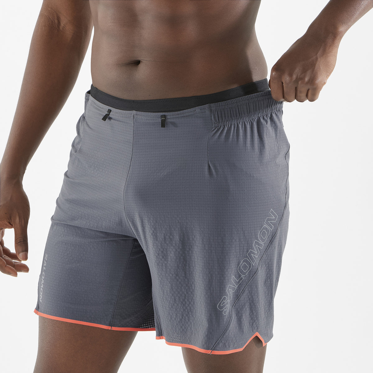 Men's Salomon Castlerock Sense Aero 7'' Shorts reflective salomon logo on model