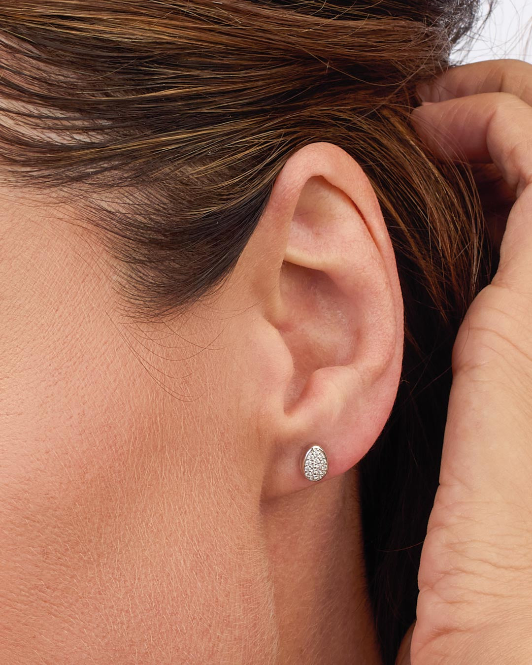 Model wears Coast Pebble Glisten Pavé Stud Earrings