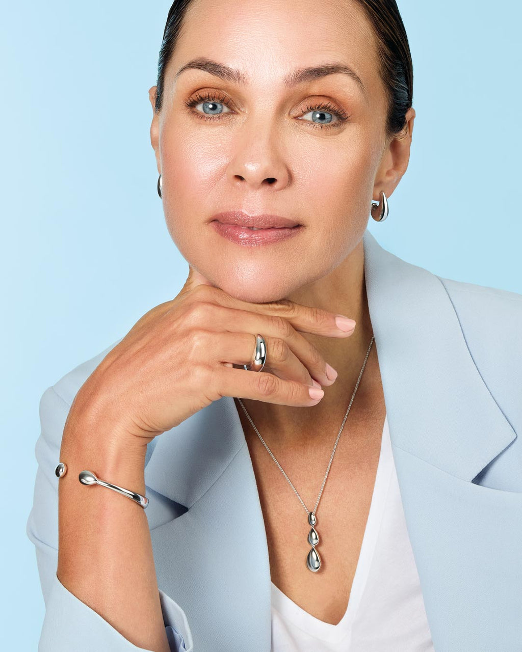 Model wears Coast Pebble Smooth Triple Grande Toggle Necklace