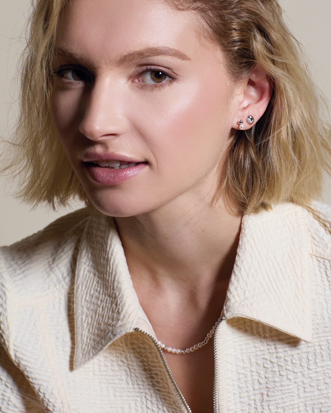 Model wears Coast Tumble Pearl Stud Earrings