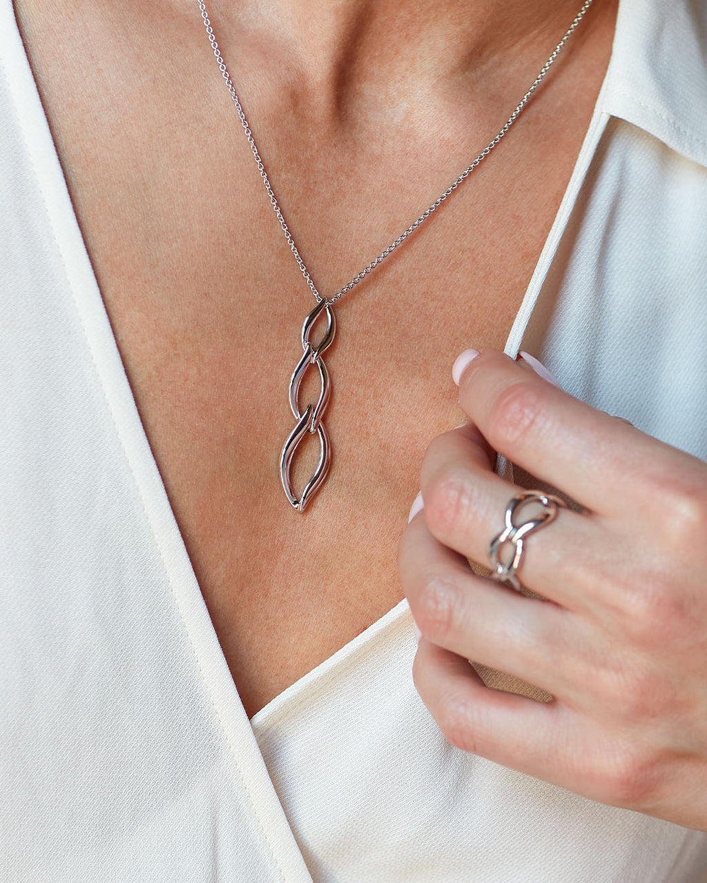 Model wears Entwine Twine Link Trio Necklace