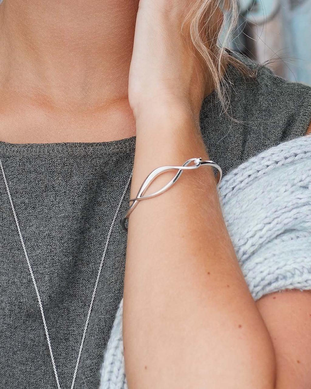 Model wears Entwine Twine Twist Hinged Bangle