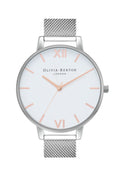 Olivia Burton watch showcasing its white dial, rose gold accents and stainless steel mesh strap.