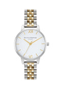 Olivia Burton watch close-up. Shows the dial, silver and gold bracelet, and branding detail.
