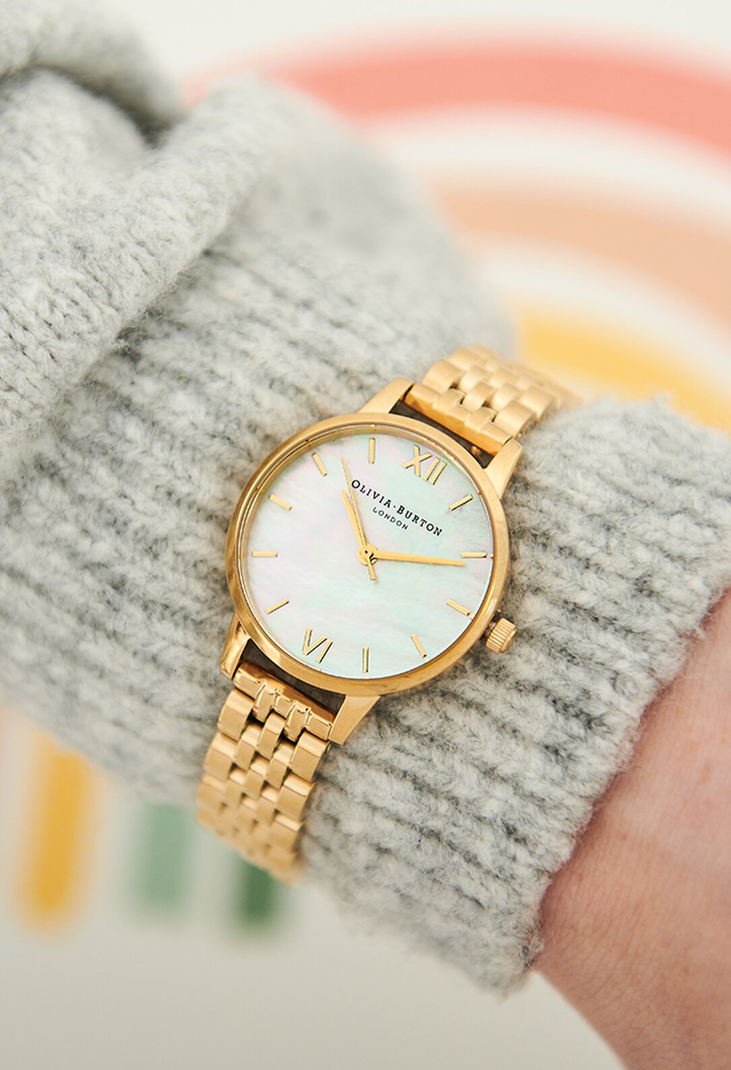 Olivia Burton Ladies Mother of Pearl Bracelet Watch Gold Plated, a gold plated watch from Olivia Burton, available at OD’s Jewellers in St Helens.