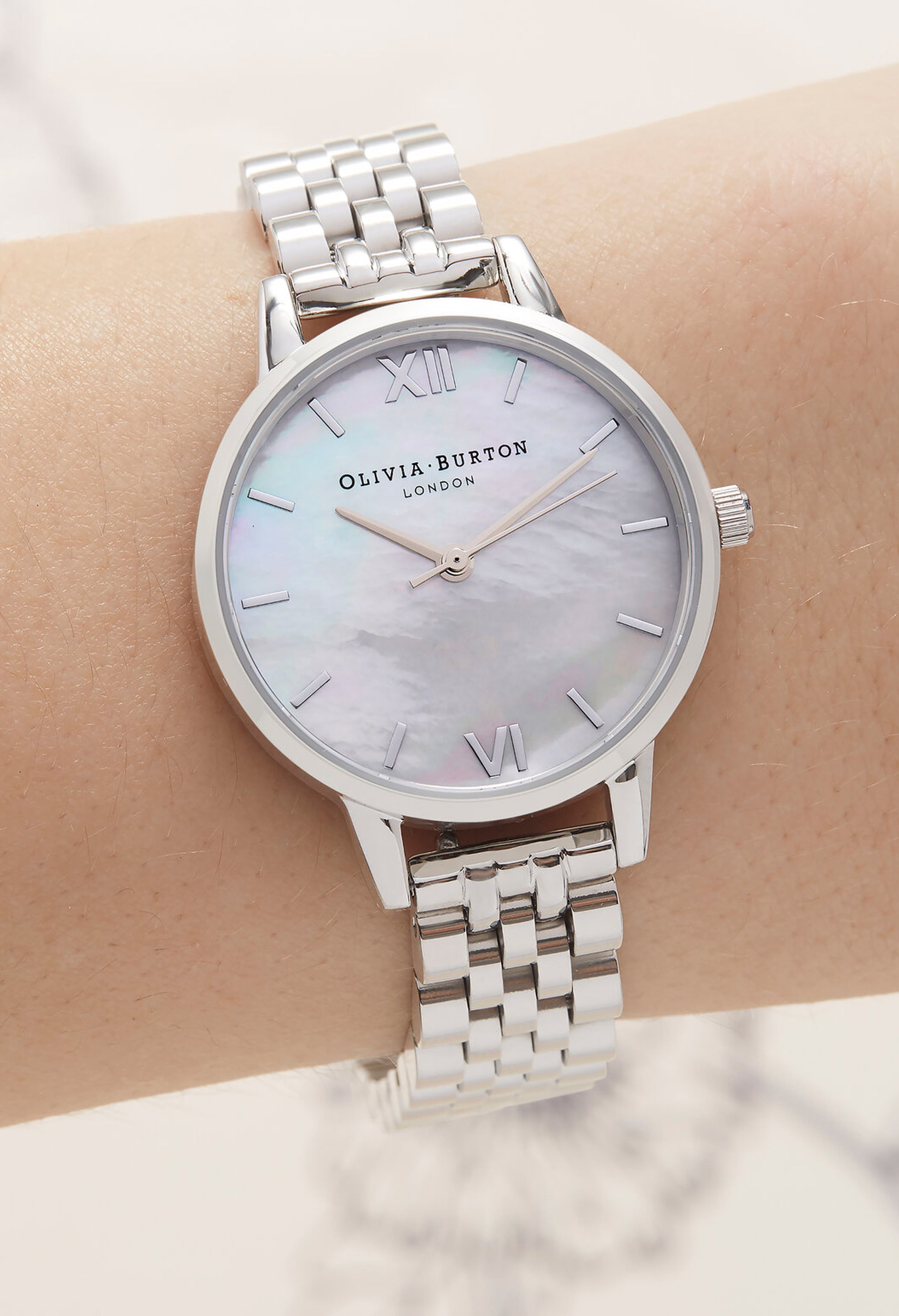 The Olivia Burton Ladies Midi Mother of Pearl Bracelet Watch, silver stainless steel from Olivia Burton, available at OD’s Jewellers in St Helens.
