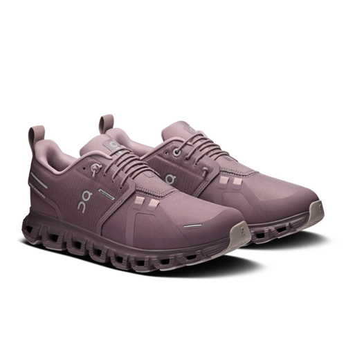 Pair of purple running shoes on a white background