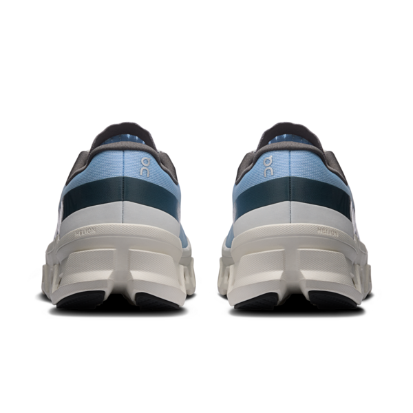 Pair of blue and gray sneakers with white soles on a white background