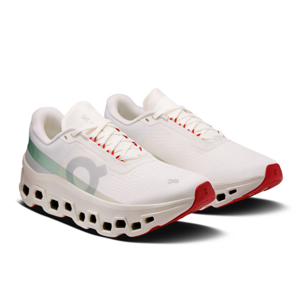 White running shoes with red accents on a white background