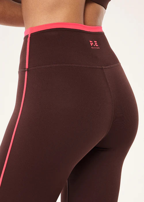 Brown leggings with pink accents on a white background
