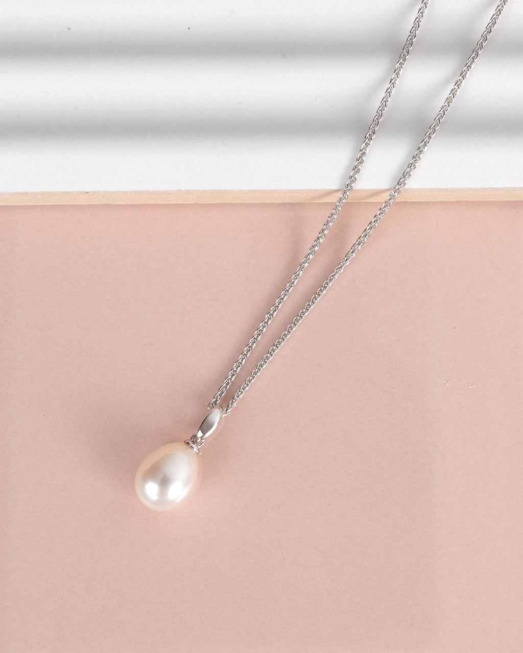 Revival Classic Pearl Necklace on a styled background