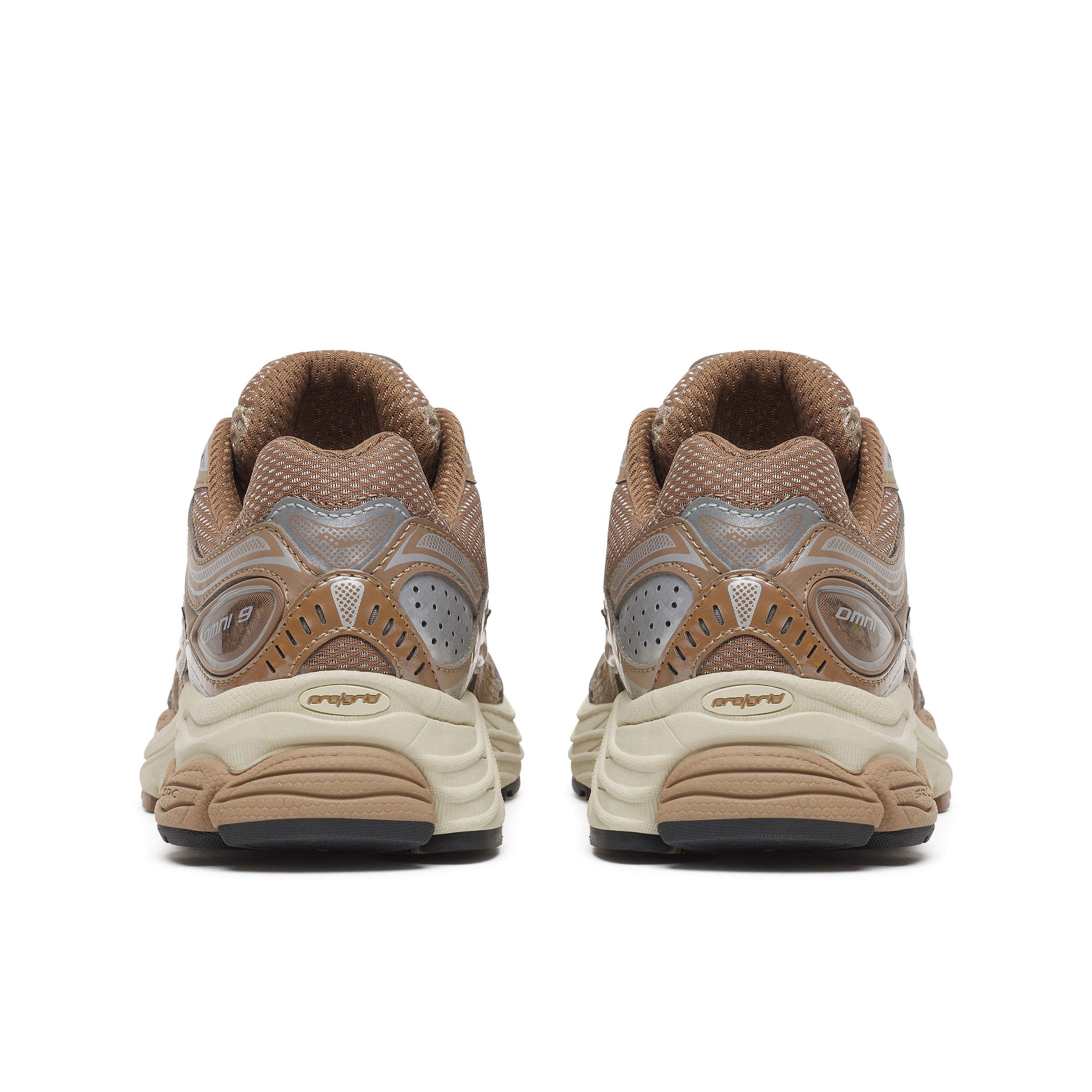A pair of vintage Nike Air Max sneakers shown from the back, featuring a brown mesh upper with metallic silver overlays and a beige and cream midsole.