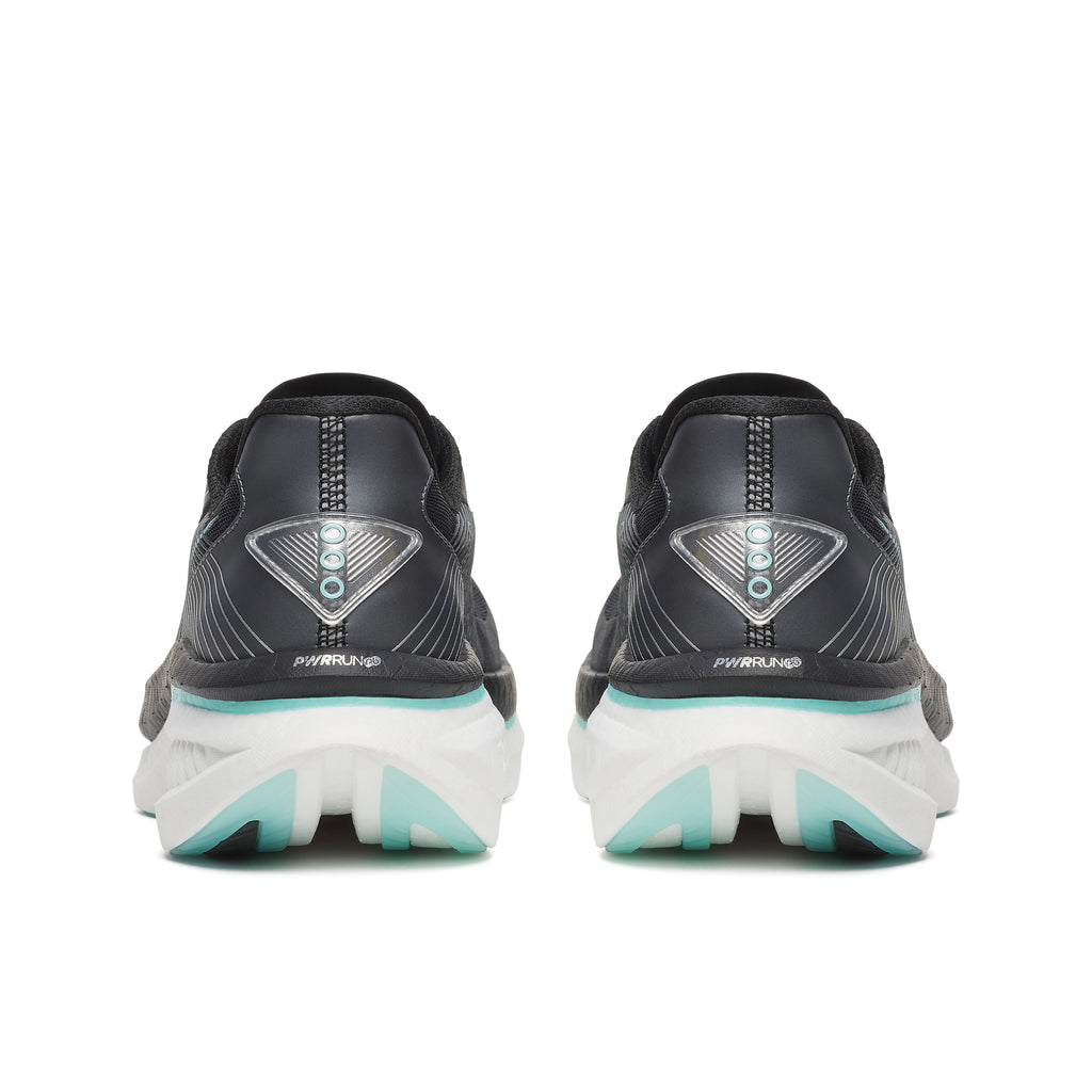 Black running shoes with white soles on a white background
