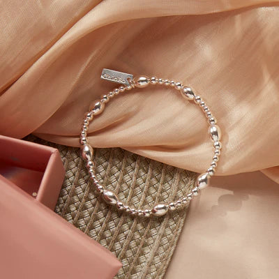 Elegant ChloBo silver bracelet with minimalist oval bead design. Delicate jewelry on display with gift box.