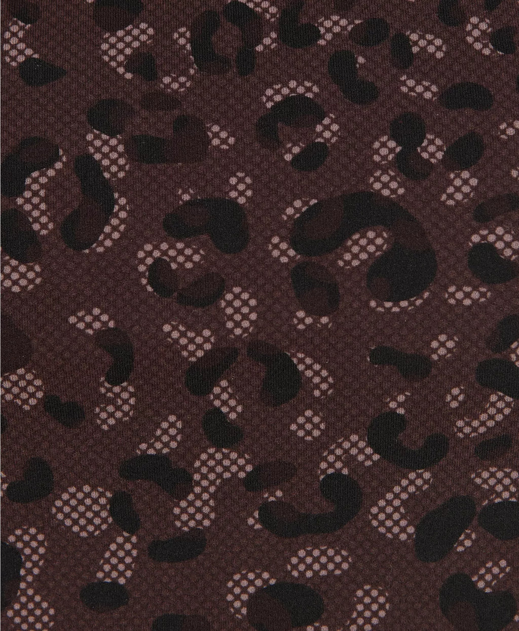 Patterned fabric with black shapes on a brown background