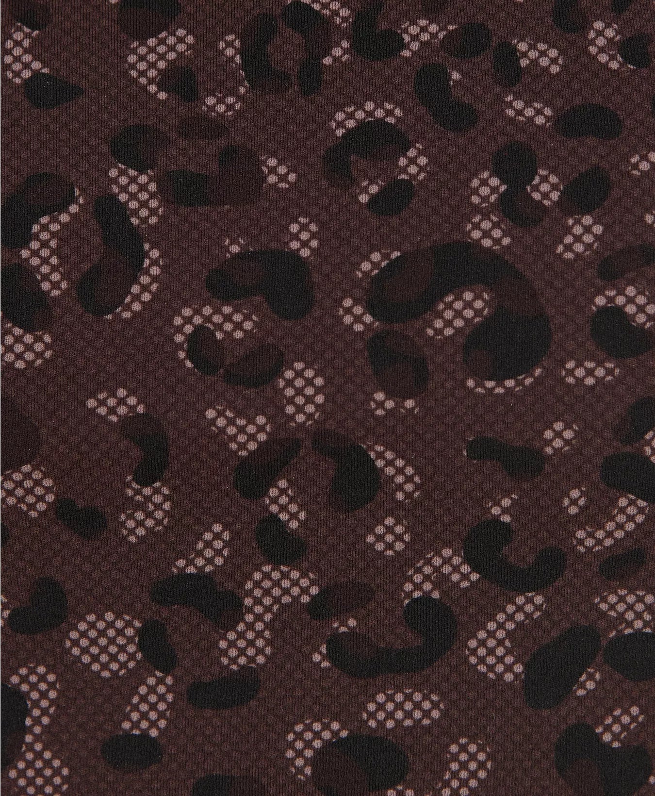 Patterned fabric with black shapes on a brown background
