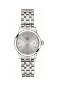Close-up of the Tissot Classic Dream stainless steel watch featuring a clear view of the watch face & date display.