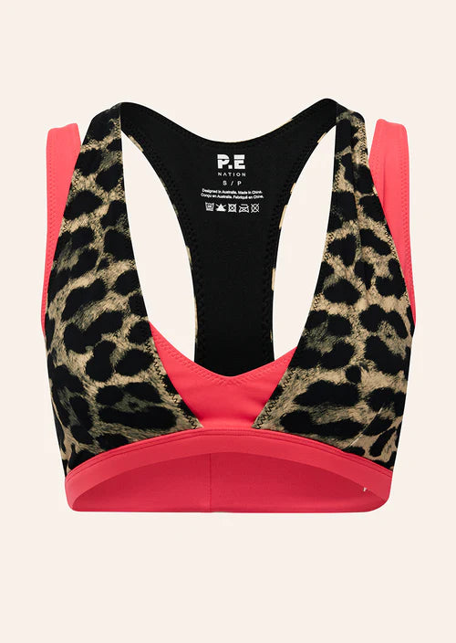 Leopard print sports bra with pink accents on a white background