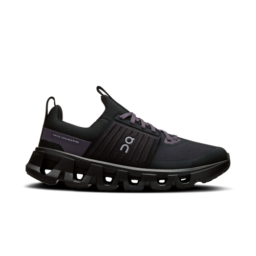 A pair of Unisex On Running Kids Black Eclipse Cloudswift 4 Trainers against a white background.