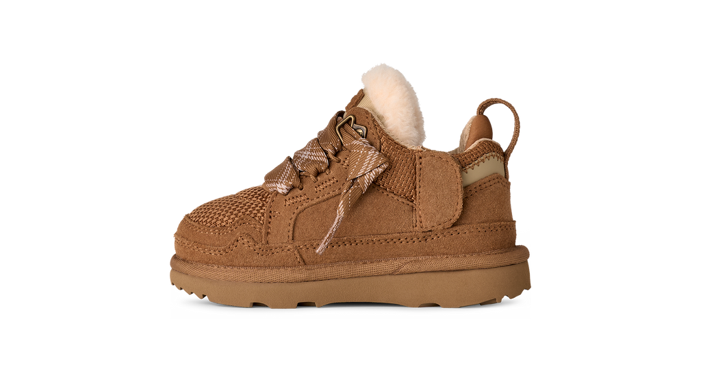 Brown children's shoe with white fur lining on a white background