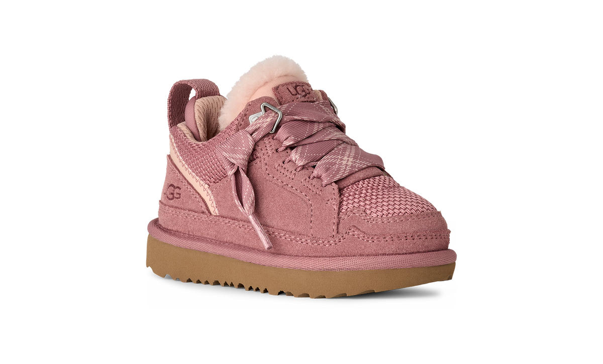 Pink sneaker with brown sole on a white background