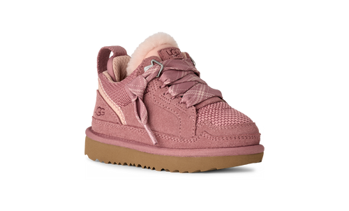 Pink sneaker with brown sole on a white background
