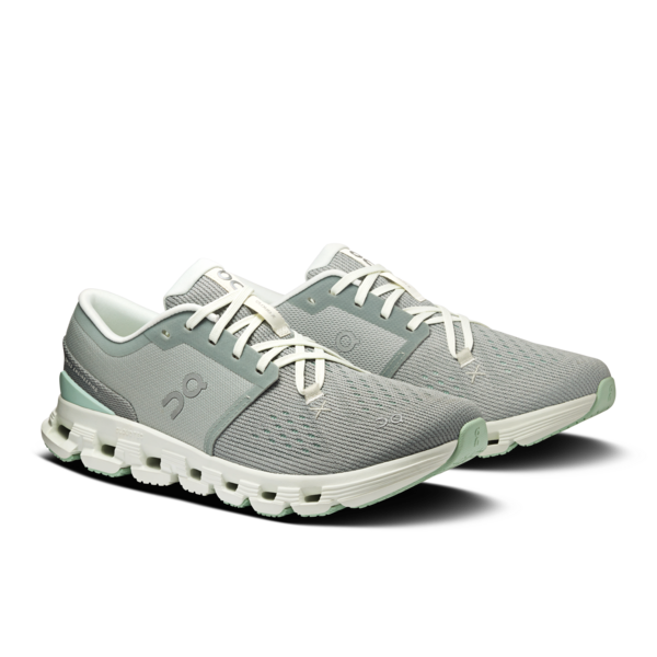 pair of mint green running trainers on a white background