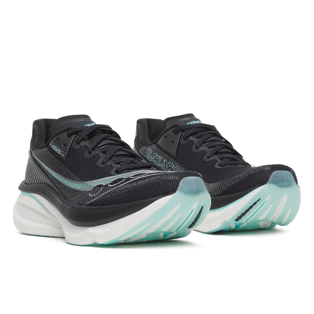 Black running shoes with teal accents on a white background