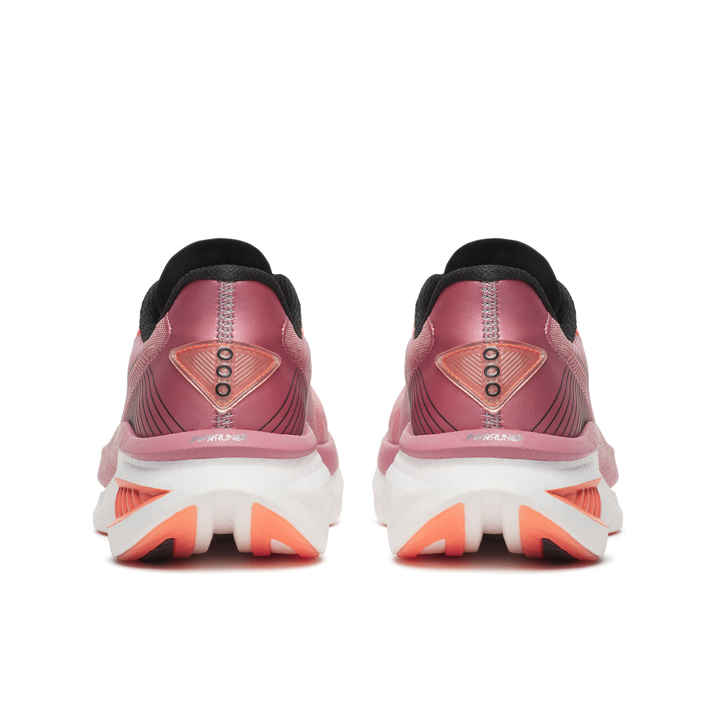 Pink running shoes with white sole on a white background