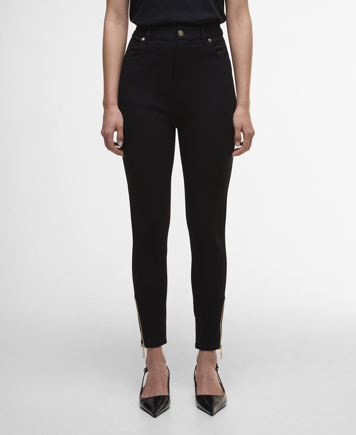 Person wearing black pants on a white background