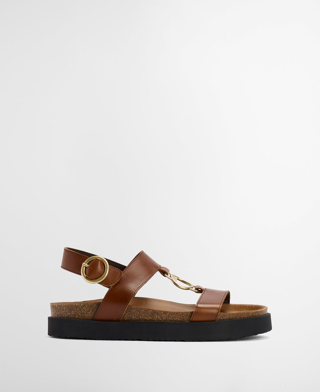Brown sandal with a gold buckle on a white background