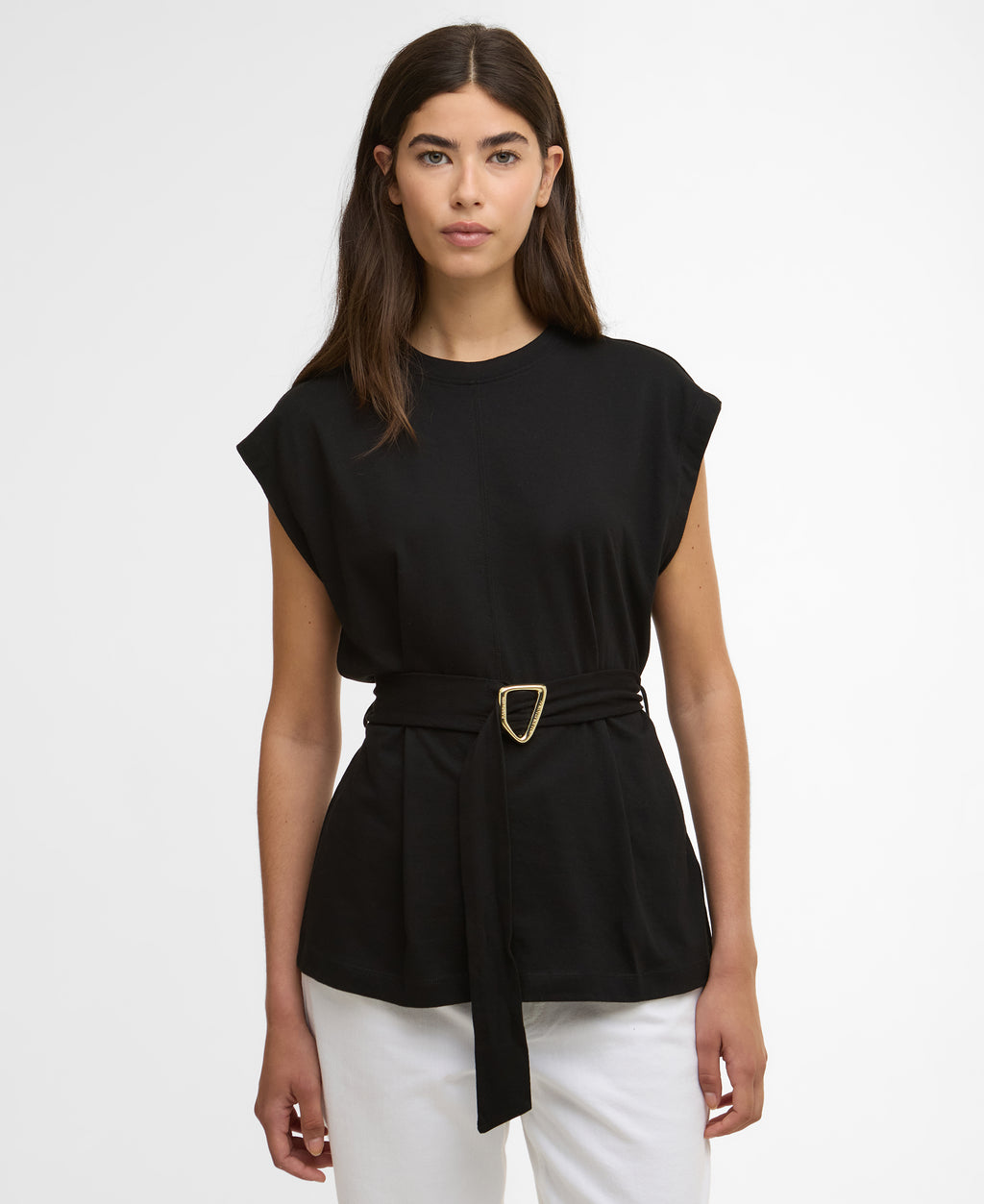 Woman wearing a black top with a belt on a white background