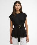 Woman wearing a black top with a belt on a white background