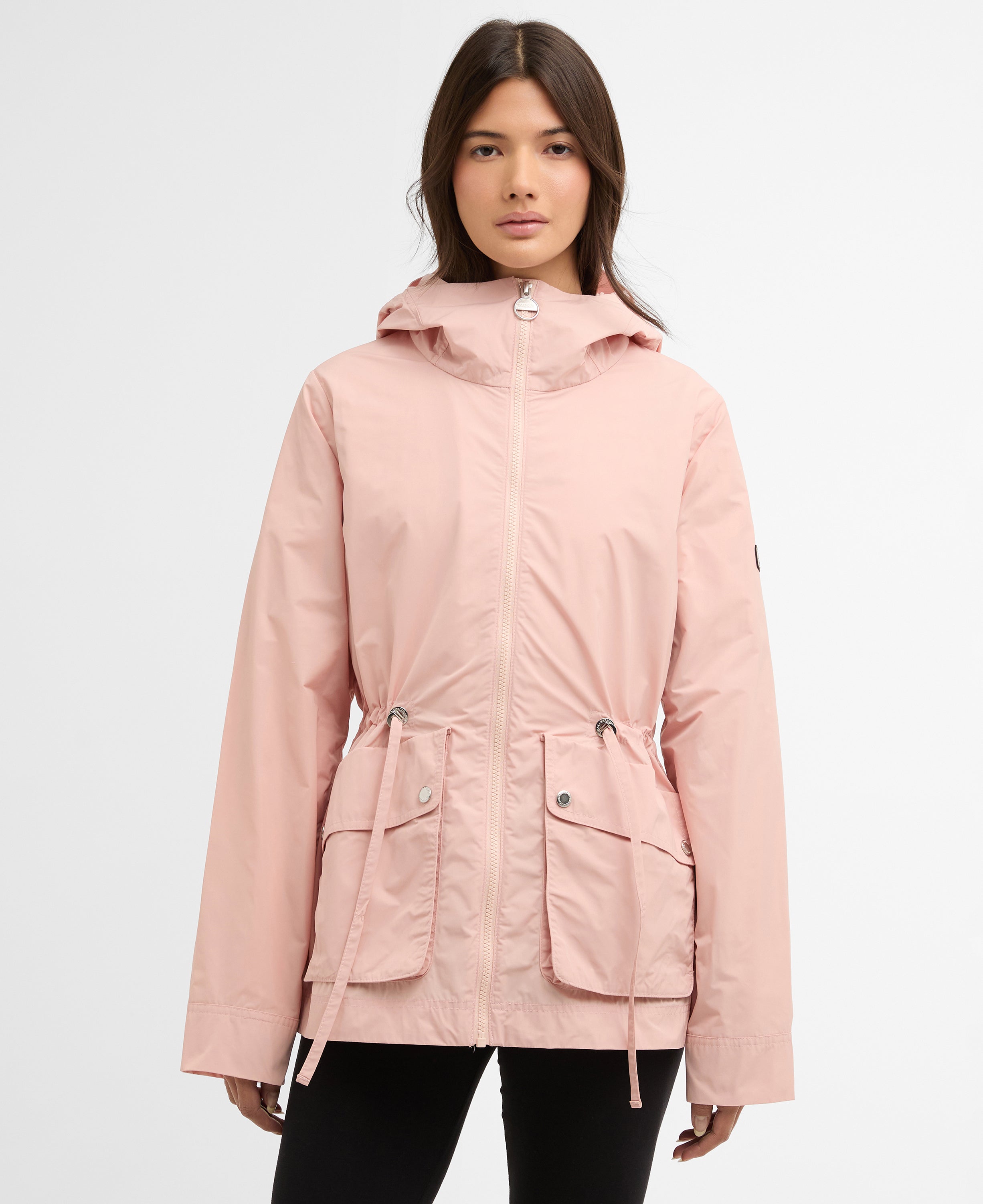 Woman wearing a pink jacket on a white background