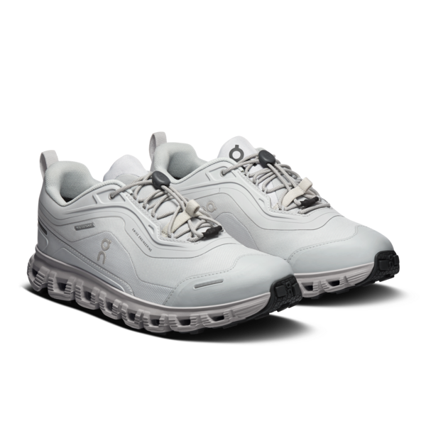 White athletic shoes with black accents on a white background