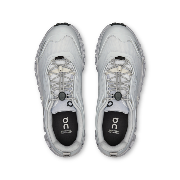 Pair of gray athletic shoes with brand logo on a white background
