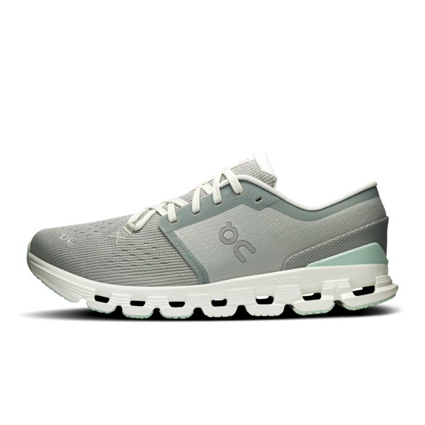 mint green running shoe with white sole on a white background