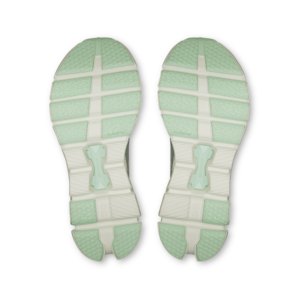 Top view of green and white shoe soles on a white background