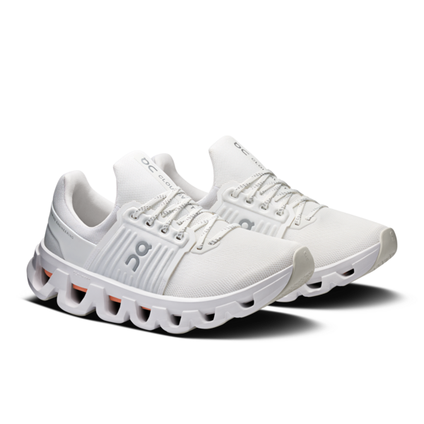 White running shoes with unique sole design on a white background