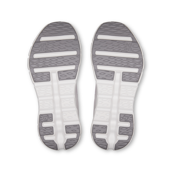 Close-up of the sole of a shoe with a white and gray design on a white background