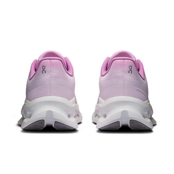 Pair of pink On running shoes with white soles on a white background