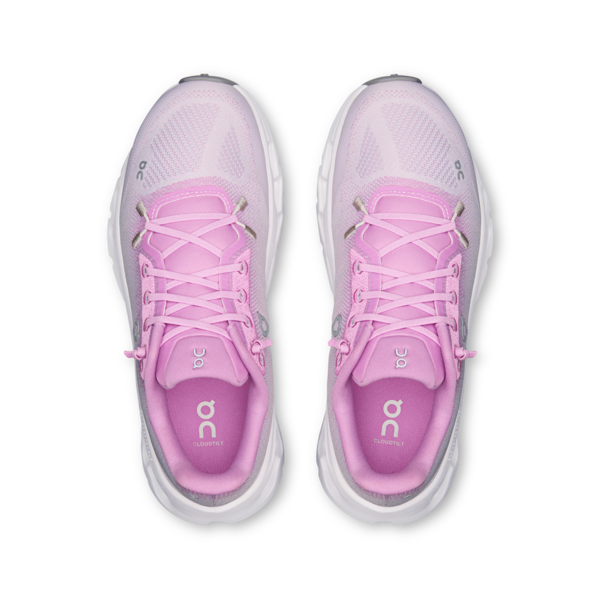 Pair of pink and gray running shoes on a white background