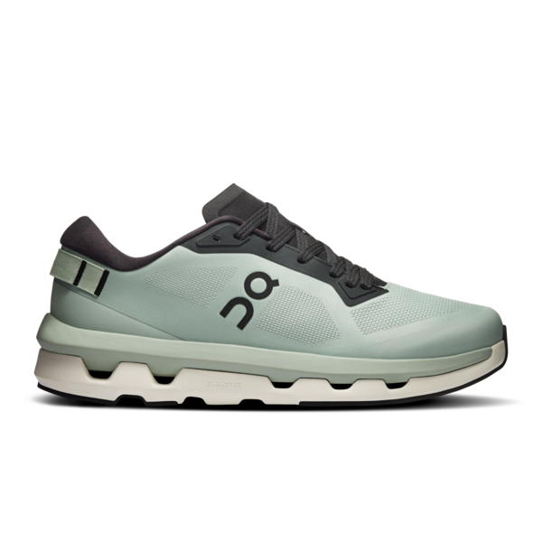 a mint green and grey sports trainer by on running on a white background