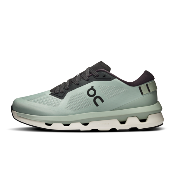 green on running trainer on a white background