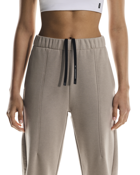 Beige sweatpants with a drawstring on a white background