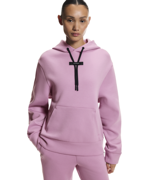 Person wearing a pink hoodie with a black drawstring on a white background