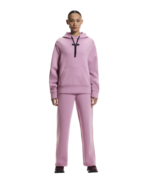 Person wearing a pink tracksuit with a black logo on a white background
